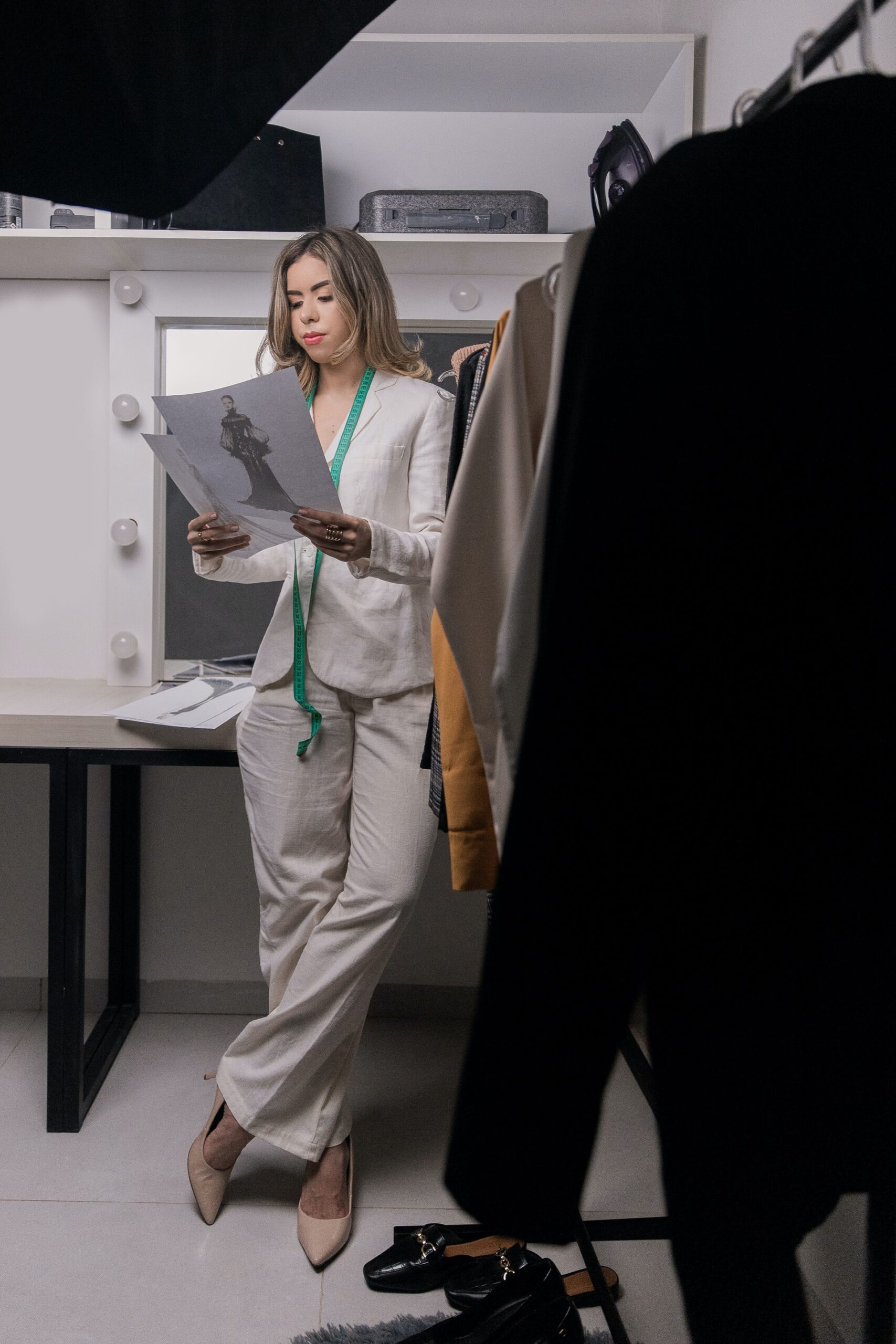 A Stylist Checking Sketches of Clothes